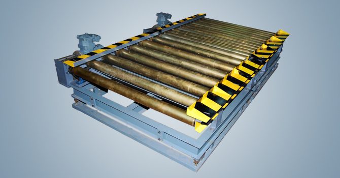 Heavy-duty powered roller conveyor with safety chevron guards manufactured by Unique Products India